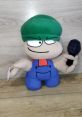 Plush toy of Bambi from Friday Night Funkin', featuring a green hat and microphone, perfect for gamers and collectors.