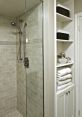 Shower stall Library The frameless glass shower door knocks open with a sharp , echoing through the room as it swings