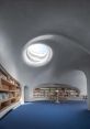 Concrete Library You can hear the echoing clatter of a wood pine board as it drops onto the cold, hard concrete floor of the