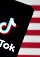 TikTok logo displayed on a smartphone against a red and white background, symbolizing social media trends in America.