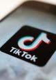 Close-up of the TikTok logo on a smartphone, highlighting its vibrant design and popularity in digital media.