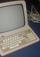 Vintage computer demonstrating French Male 1 voice feature with unique keyboard layout and design, ideal for language learning.