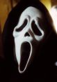 Iconic Ghostface mask from the Scream series, features a haunting expression and dark hood, symbolizing horror.