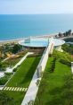 Stunning view of a modern library with surrounding greenery and a rooftop pool overlooking the ocean at Water Hatch Library.