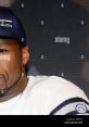 50 Cent in a stylish hat, showcasing his signature look and charisma, perfect for fans and hip-hop enthusiasts alike.