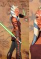 Ahsoka Tano wielding a green lightsaber, showcasing her signature look and bold character in a desert backdrop.