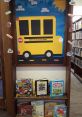 Colorful display at Beeping Library showcasing children's books and a school bus theme encouraging reading fun.