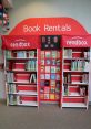 Colorful toddler library book rental display with shelves filled with children's books and vibrant signage for easy access.