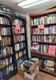 Bookshelves filled with various genres at Danby Library, showcasing pre-owned books available for purchase.