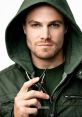 Close-up of a man in a green hoodie holding a sharp tool, evoking themes from Arrow and character dynamics.