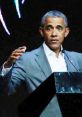 Barack Obama delivering an engaging speech with an assertive gesture, highlighting impactful leadership and communication.