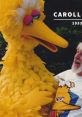 Caroll Spinney joyfully interacting with Big Bird, showcasing a memorable moment with the beloved character.