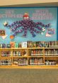 Colorful library display promoting summer reading with an octopus made of paper chains, surrounded by various books.