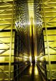 Automated storage system in a robotic library, featuring high shelves and bright illumination along the aisle.