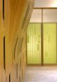 Contemporary wooden architectural design with layered textures and green patterned glass in a modern slider library setting.