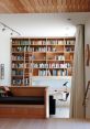 Setting down Library The air in the library is filled with the of books being placed down into a wooden pine drawer. The