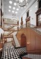 Elegant interior of the Bake Library featuring grand staircases, ornate woodwork, and striking black-and-white checkered flooring.