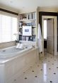 Elegant master bathroom with a cozy library nook, featuring a soaking tub, bookshelves, and natural light for relaxation.