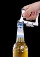 Bottle opener Library The clinking of the bottle opener handle being set to the neck of a beer bottle is a familiar and