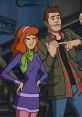 Daphne Blake, styled in purple with a green scarf, poses confidently alongside a character in a spooky setting.