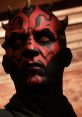 Darth Maul's intense gaze and menacing expression highlighted by intricate red and black face paint for a striking appearance.