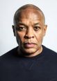 Dr. Dre, iconic rapper and producer, exuding confidence and charisma in a close-up portrait.