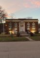 Hamburg Library's historic brick building at dusk, showcasing elegant architecture and inviting entryway.