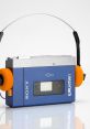 Walkman Library The of buttons being clicked on a Sony Walkman cassette player echo through the room, creating a sense of