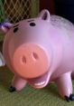 Cheerful pink pig character resembling Hamm from Toy Story, known for his humorous personality and wisecracks.