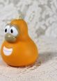 Cute orange rubber gourd toy with big eyes, inspired by Jimmy Gourd from the 2000 animation classic. Perfect for collectors!