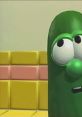 Larry the Cucumber looking concerned in a colorful room from "Where's God When I'm Scared?" reflects childhood fears and faith.