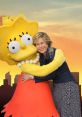 Yeardley Smith joyfully poses with Lisa Simpson, showcasing their iconic bond in a colorful backdrop.