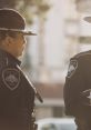 Female police officers engaged in conversation, showcasing Mafia 3 Police Dispatch clothing and law enforcement setting.