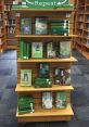 Book display featuring a selection of green-covered titles for high school teams in the library, promoting reading and engagement.