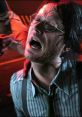 Otacon in distress, showcasing a tense moment from MGS1. Emotional depth and intense storytelling highlighted.