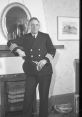 Historic merchant marine officer poses in uniform, reflecting maritime heritage and the legacy of seafaring service.