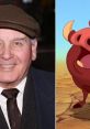 Ernie Sabella smiles while portraying Pumbaa from The Lion King, showcasing his iconic character alongside his real-life persona.