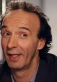 Roberto Benigni smiling, showcasing his charismatic personality in a casual setting. Celebrated Italian actor and director.