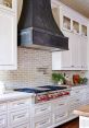 Elegant kitchen featuring a stylish range hood, modern cabinetry, and a sleek gas stove, perfect for culinary enthusiasts.