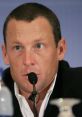 Lance Armstrong speaks at a press conference, addressing doping allegations and his cycling career challenges.