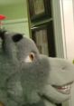 Close-up of a donkey puppet inspired by Shrek (SML), featuring playful expression and vibrant colors against a home backdrop.