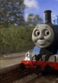 Cheerful Thomas the Tank Engine at a station, showcasing his iconic blue body and friendly face. Perfect for young fans!