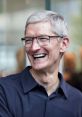 Tim Cook smiling while wearing glasses, embodying leadership and innovation in the tech industry.