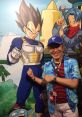 Brian Drummond poses next to Vegeta artwork at a convention, showcasing his iconic voice role and character enthusiasm.