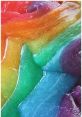 Colorful, glossy rainbow slime in vibrant hues of red, orange, yellow, green, blue, and purple, showcasing a smooth texture.