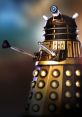 Golden Dalek with iconic shape, protruding eye stalk, and plungers, representing classic sci-fi villain from Doctor Who.