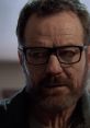 Close-up of Walter White, portraying a serious expression with glasses and a beard, reflecting his complex character.