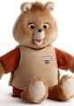 Classic Teddy Ruxpin plush toy with tan fur, smiling expression, and signature vest, perfect for nostalgic collectors.