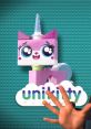 Colorful Unikitty figure with unicorn horn and large eyes, showcasing playful design by Alison Brie, inviting imaginative play.