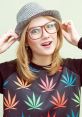 Smiling woman in a colorful leaf-patterned sweater and hat, embodying fun stoner culture and carefree vibes.